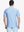 Back half-body showing soft gradient stripes of POWDER BLUE WHITE stripe polo