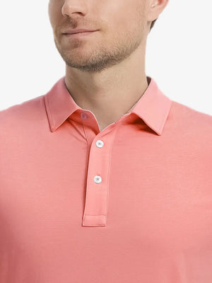 Close-up front shot from nose to chest of model wearing PEACH PINK 4 Way Stretch Jacquard Polo