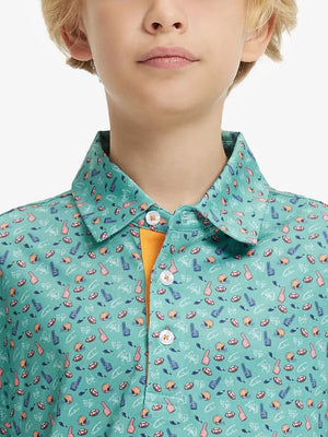 Close-up front view from nose to chest of boy wearing GREEN RUGBY Performance Print Boys Golf Polo