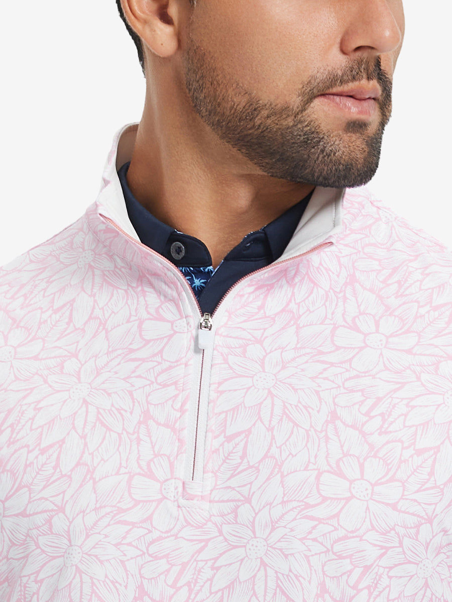 Close-up from nose to chest, showing zipper collar detail and fabric pattern of the pink artichoke pullover.