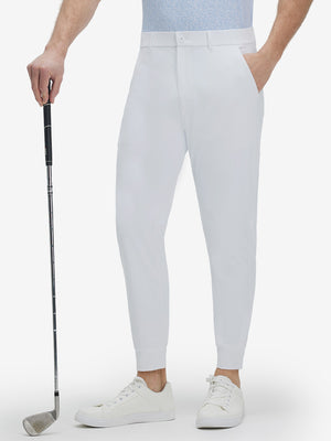 Front lower body shot of model wearing white flat front golf joggers pants with belt loops