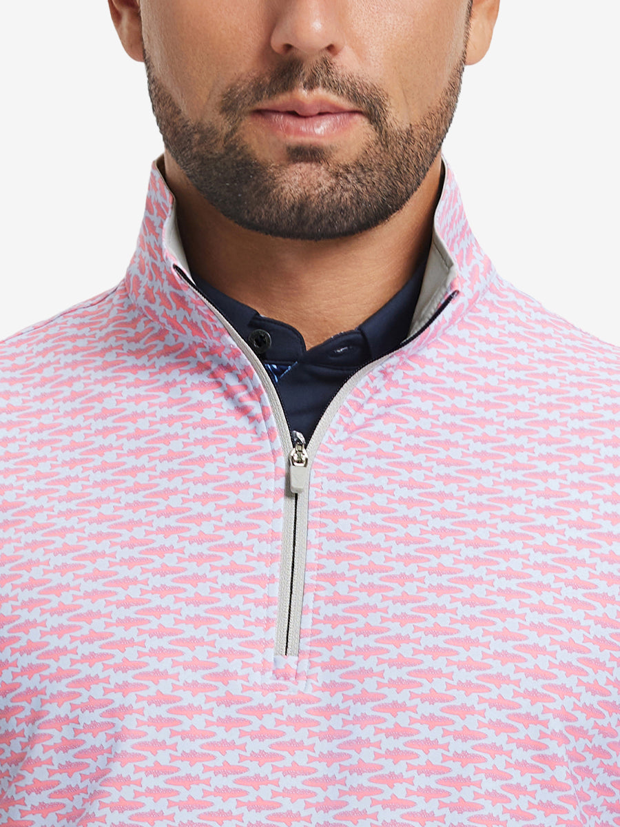 Close-up from nose to chest, showing zipper collar detail and fabric pattern of the pink small fish pullover.