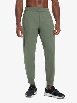 Front lower body view of model wearing OLIVE GREEN Performance Tapered Sports Joggers