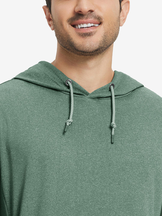 Close-up from nose to chest, showing soft heather texture and collar detail of the dark green melange hoodie.