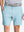 Front view of youth wearing sky blue Heather Performance Golf Shorts, showing fit and style