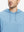 Close-up from nose to chest, showing soft heather texture and collar detail of the light blue melange hoodie.
