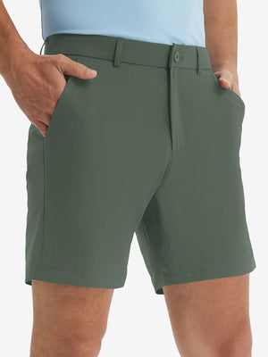 Front lower body shot of model wearing the grey green stretch soft flat front dress golf shorts, showcasing the fit