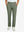 Front lower body view of model with hand in pocket, wearing quick dry casual dress pants in olive green.