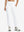 Model wearing women's stretch fleece lined water resistant joggers in white, showcasing the front lower body view.