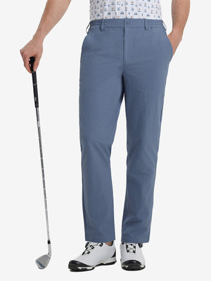 Front lower leg view of Performance Water Resistant Pants in DUSTY BLUE，model holds golf club in right hand.