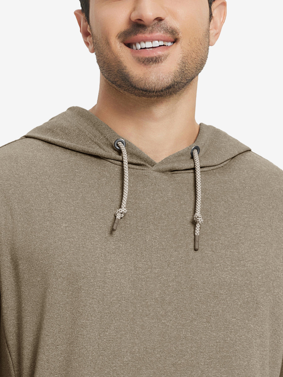 Close-up from nose to chest, showing soft heather texture and collar detail of the brown melange hoodie.