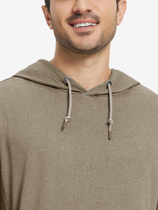 Close-up from nose to chest, showing soft heather texture and collar detail of the brown melange hoodie.