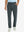 Front lower body view of model with hand in pocket, wearing quick dry casual dress pants in dark grey.