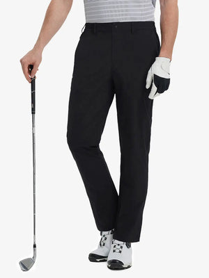 Front lower leg view of Performance Water Resistant Pants in BLACK，model holds golf club in right hand.