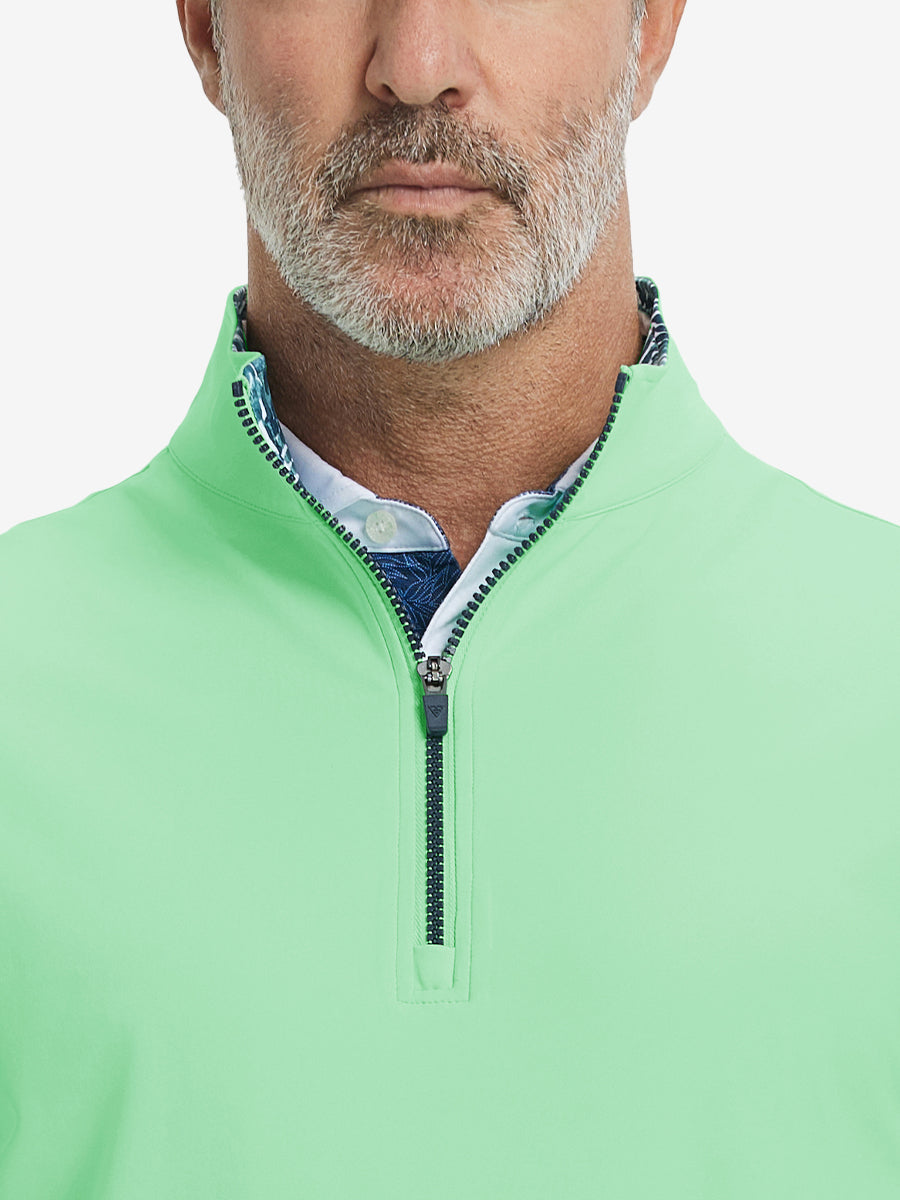 Close-up from nose to chest, showing collar detail and zipper of the dark grey golf vest.
