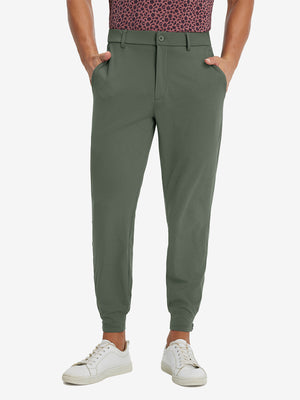 Model wearing Lightweight Ankle-Zip Sweatpants with 4 Pockets in olive green, lower body front view