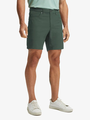 OLIVE GREEN 4-way Stretch Performance Solid Shorts, golfer front lower body with club, 7 Inch view