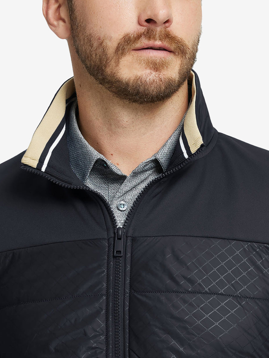 Close-up from nose to chest, showing collar detail and fleece texture of the black winter jacket.