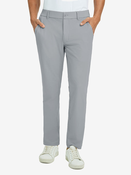 Front lower body view of model with hand in pocket, wearing quick dry casual dress pants in light grey.