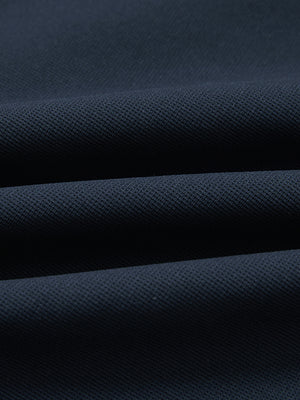Fabric close-up of lightweight moisture wicking dress pants, showing texture and finish in navy.
