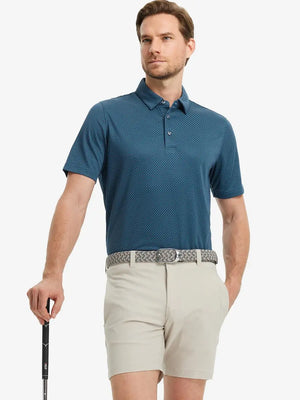 Full body front view of model wearing NAVY BLUE Your Favorite Jacquard Polo, holding a golf club