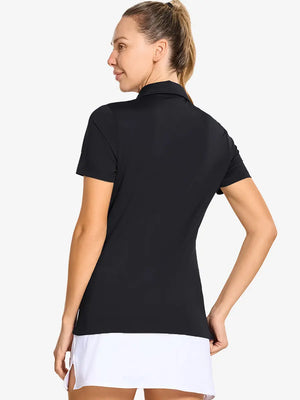 Back-side half-body shot of model in BLACK Women's Performance Solid Polo, looking over shoulder