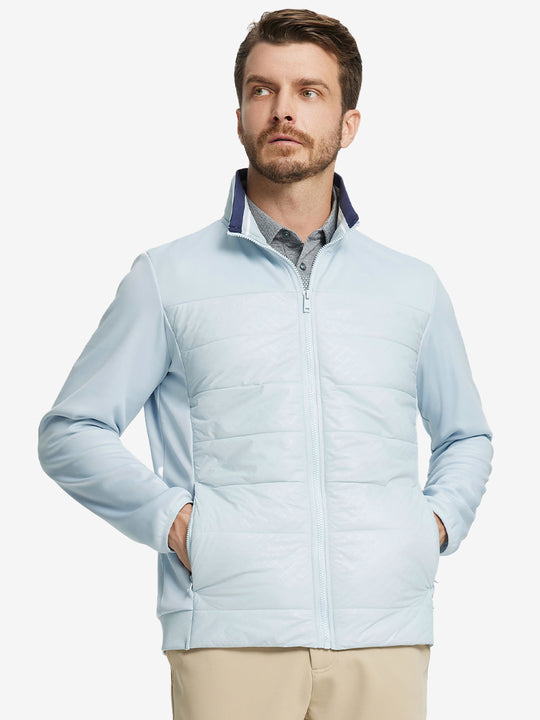 Front view of model with both hands in side pockets, wearing Golf Fleece Winter Jacket in Glacier Grey.
