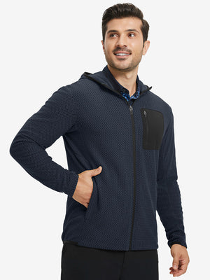 Model with one hand in pocket wearing full zip fleece hoodied jacket in navy, relaxed look.