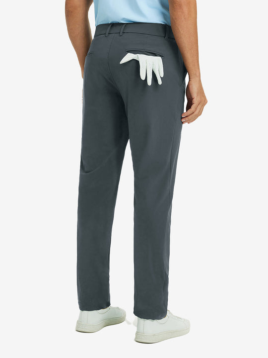 Back view of dark grey quick dry casual dress pants, golf glove tucked in rear pocket for sporty touch.
