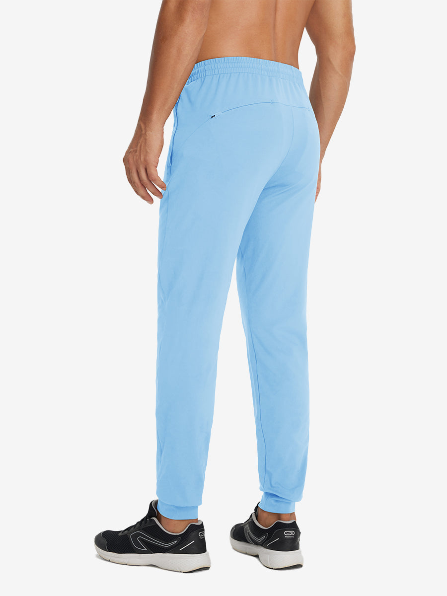 Back lower-body view showing lightweight traning track pants on model in light blue.
