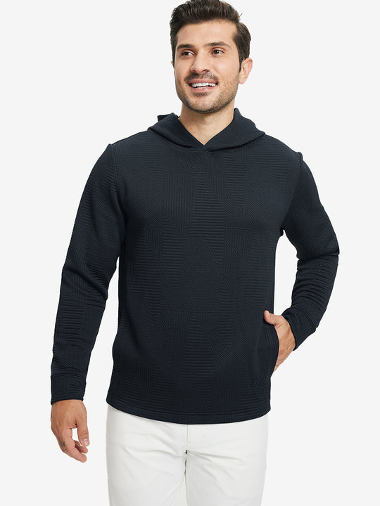 Model front upper body, one hand in pocket, wearing texture solid hoodies pullover, navy.