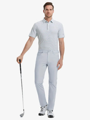 Full-body front shot with golf club, styled in Stretch Plain Everyday Pants – GLACIER GREY