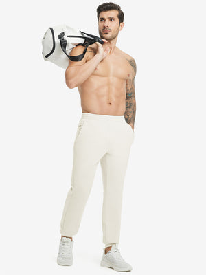 Full body front view of model wearing Water Resistant Comfy Fleece Golf Joggers in cream