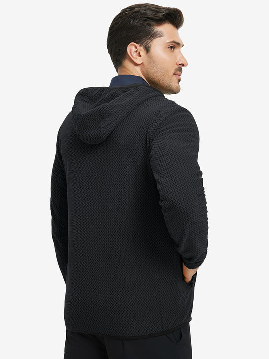 Back upper view of model in full zip fleece hoodied jacket, showing fit and seams in black.