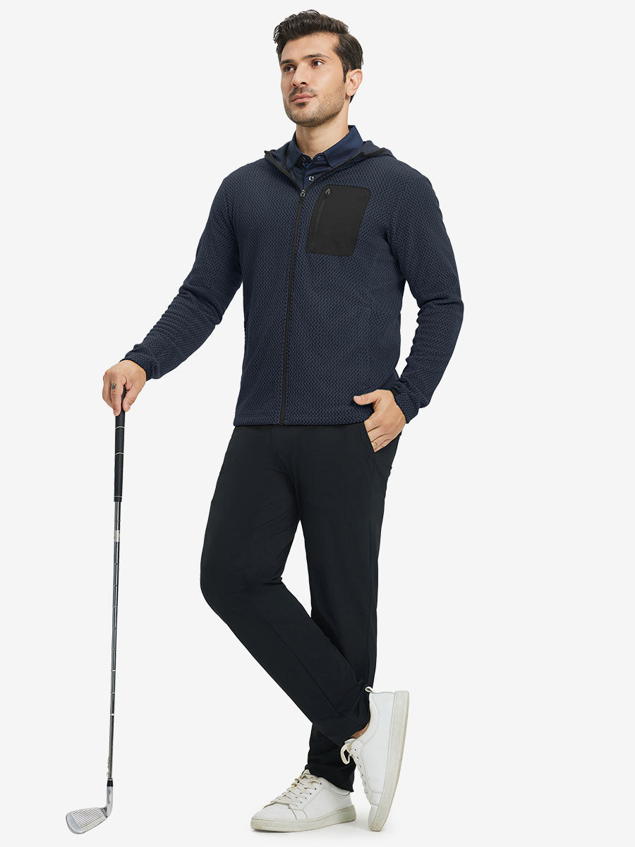 Model holding golf club, dressed in full zip fleece hoodied jacket in navy, sporty and casual.