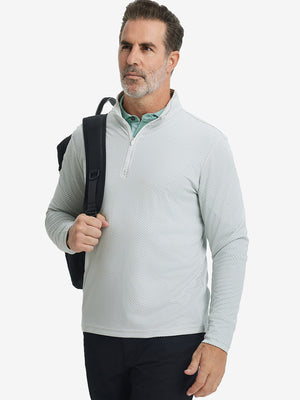 Model carrying a bag in jacquard quarter zip pullover in light grey, blending comfort and style.