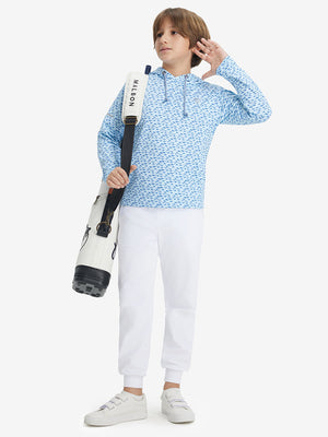 Full-body shot of model wearing white fleece stretch water resistant boys joggers with a golf bag on her back.