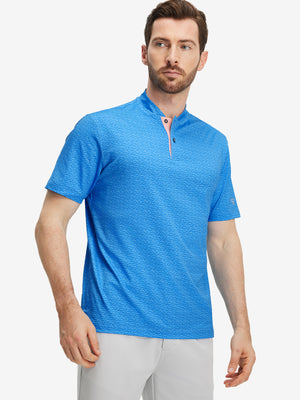 Front half-body of model in blue wave dolphin stretch printed collarless henley golf shirts