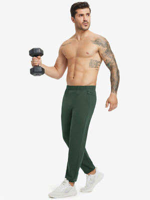 Full body front view of model wearing Water Resistant Comfy Fleece Golf Joggers in forest green