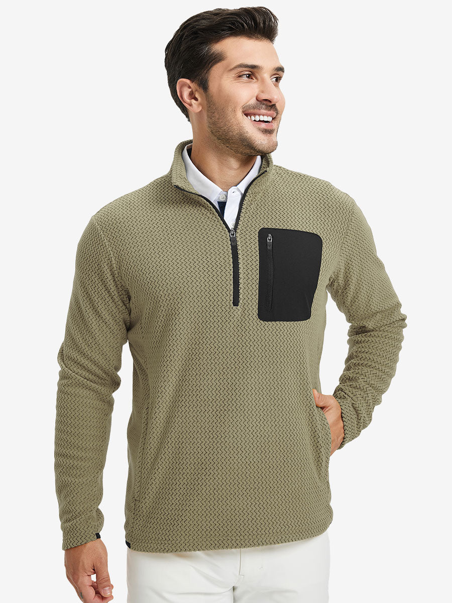 Model with one hand in side pocket, wearing midweight warm stretchy quarter zip pullover in desert yellow.