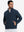 Model with both hands in pockets, wearing soft winter fleece jackets in navy, warm and relaxed.
