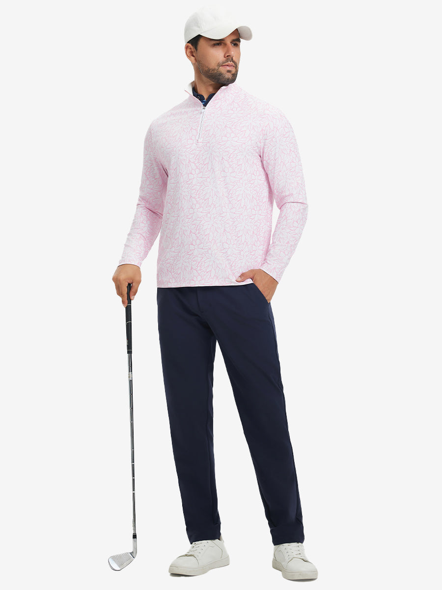 Full-body shot of model holding golf club, dressed in full print quarter zip pullover in pink artichoke.