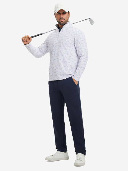 Full-body shot of model holding golf club, dressed in full print quarter zip pullover in brown grey camo.