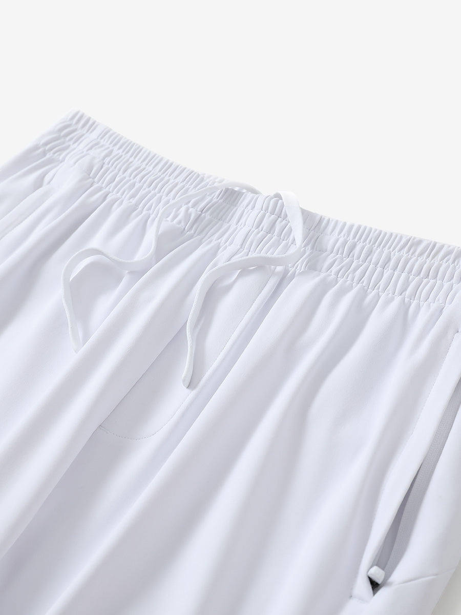 Angled view of lightweight women's stretchy joggers sweatpants waistband displayed in white.