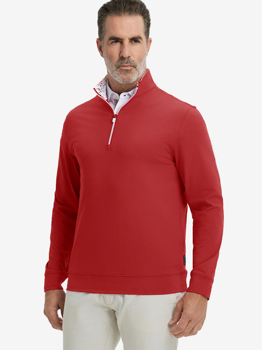Front upper body view of model wearing lightweight golf quarter zip pullover in red, relaxed fit.