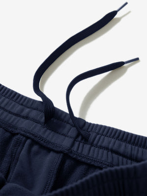 Close-up of the waistband with drawstring detail of navy fleece stretch water resistant boys joggers.