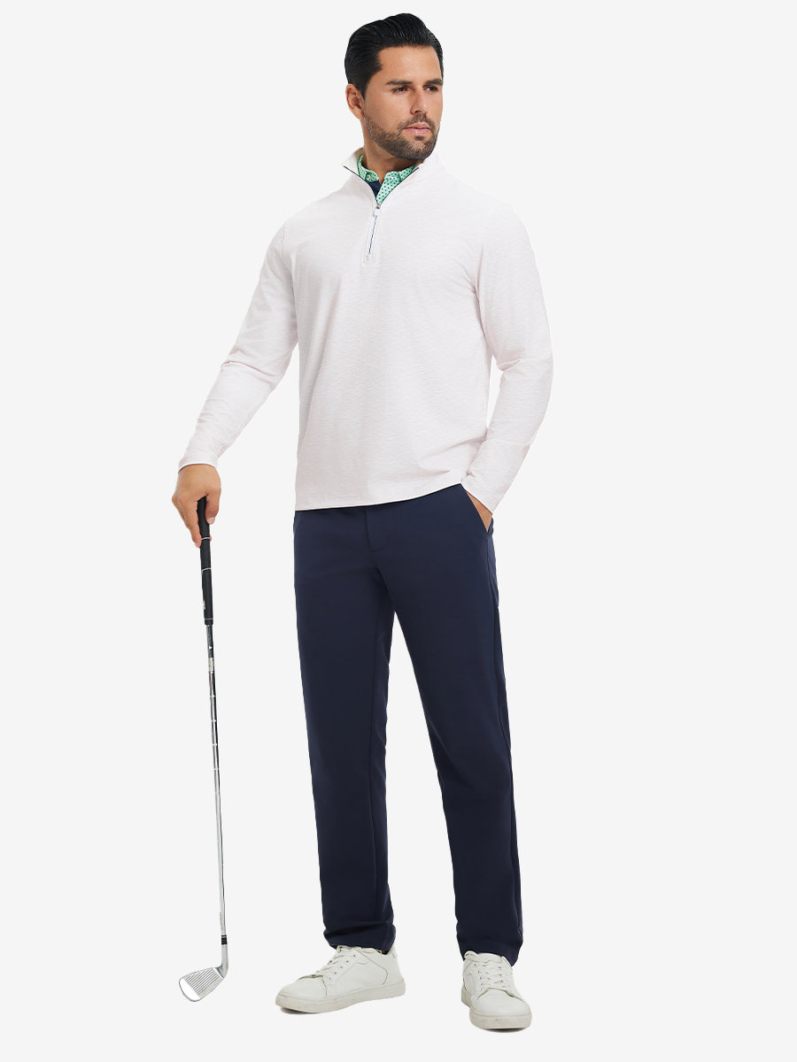 Full-body shot of model holding golf club, dressed in full print quarter zip pullover in orange line.
