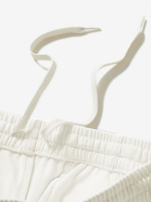 Close-up of the waistband with drawstring detail of beige fleece stretch water resistant boys joggers.