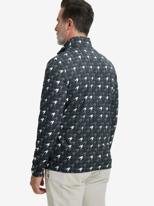 Back upper body angle of the grey houndstooth full print quarter zip pullover, model turns head slightly.