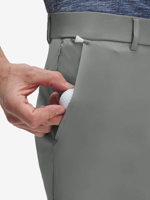 Detail view of front pocket on iron grey flat front golf joggers pants with belt loops